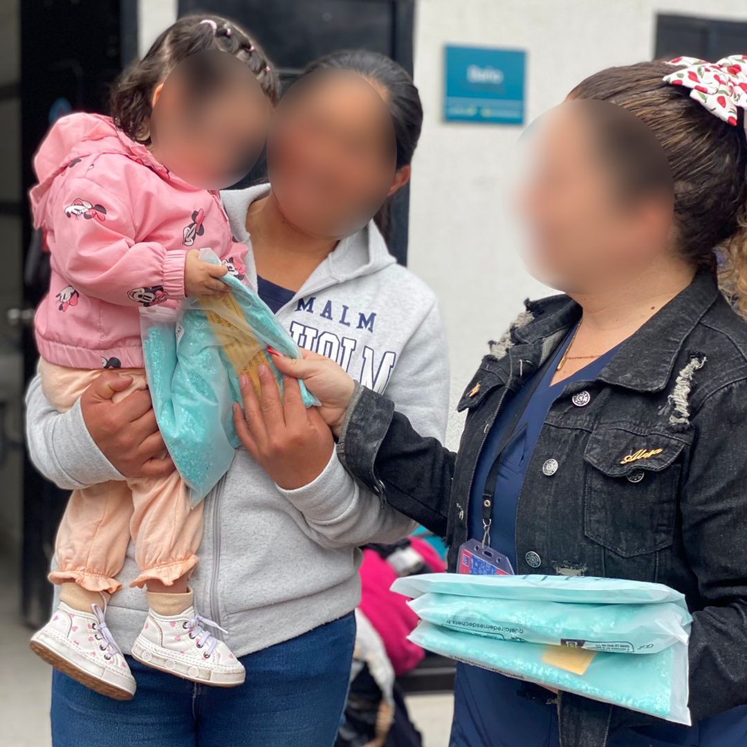Mothers receiving Magnetic Onesies at Fundación Niños de los Andes in Bogotá